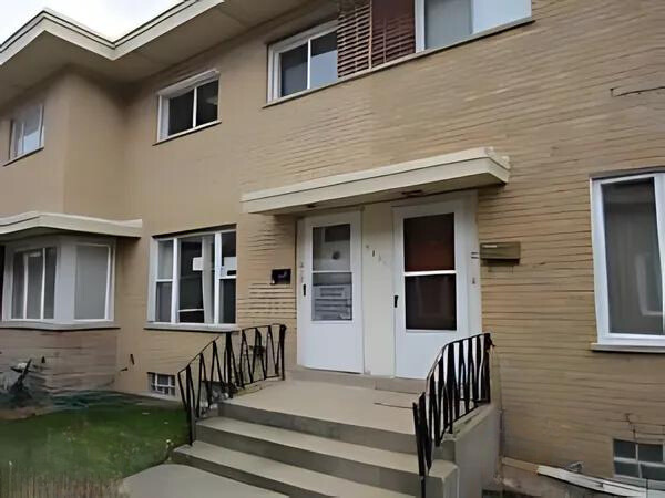 a front view of a house with stairs