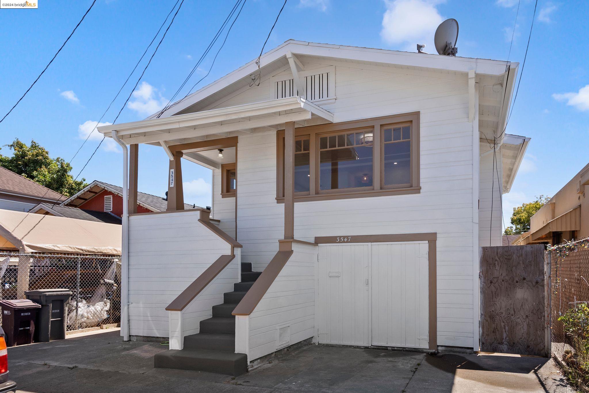 a front view of a house with stairs