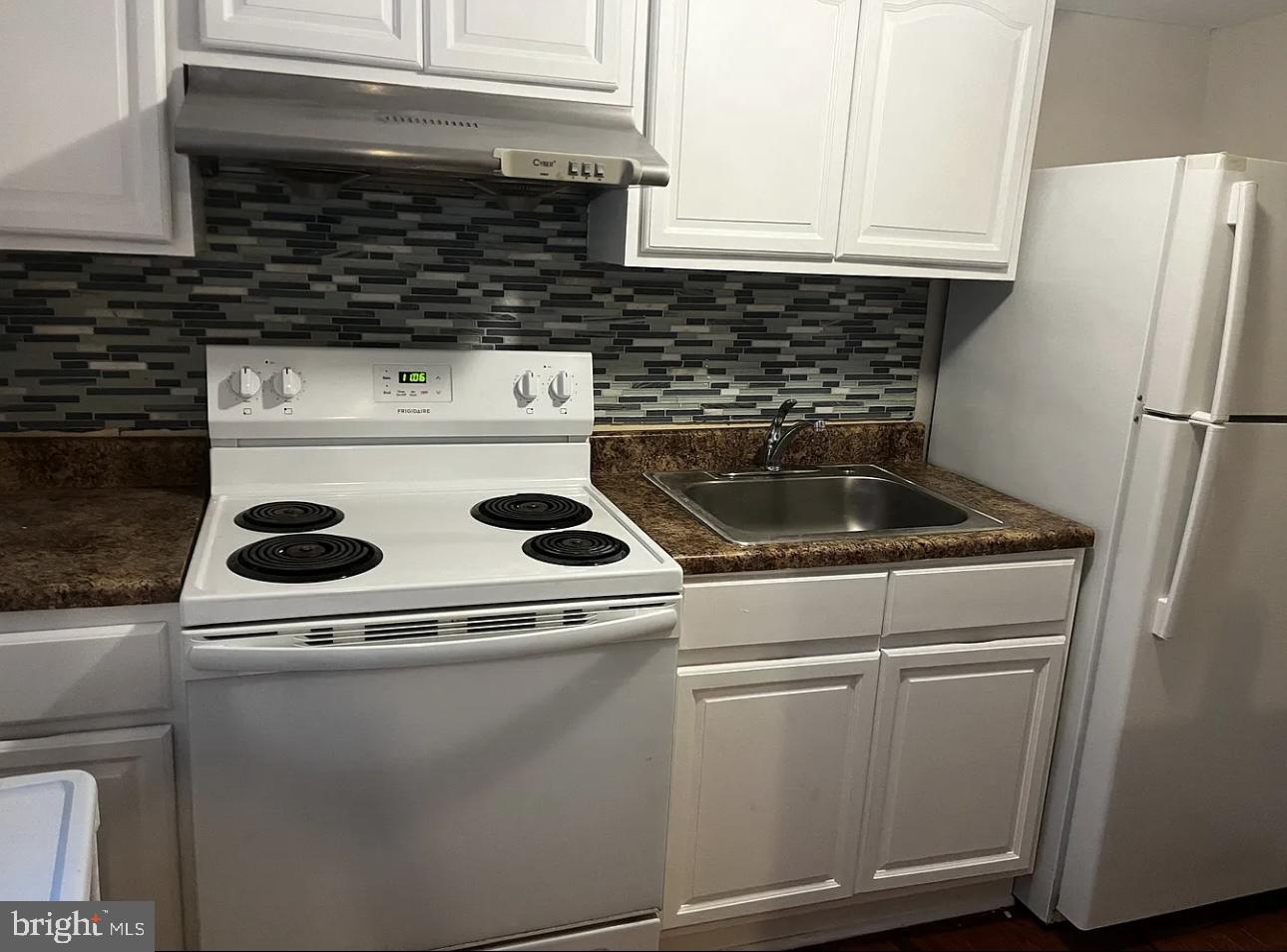 a close view of a stove top oven sitting inside of a kitchen