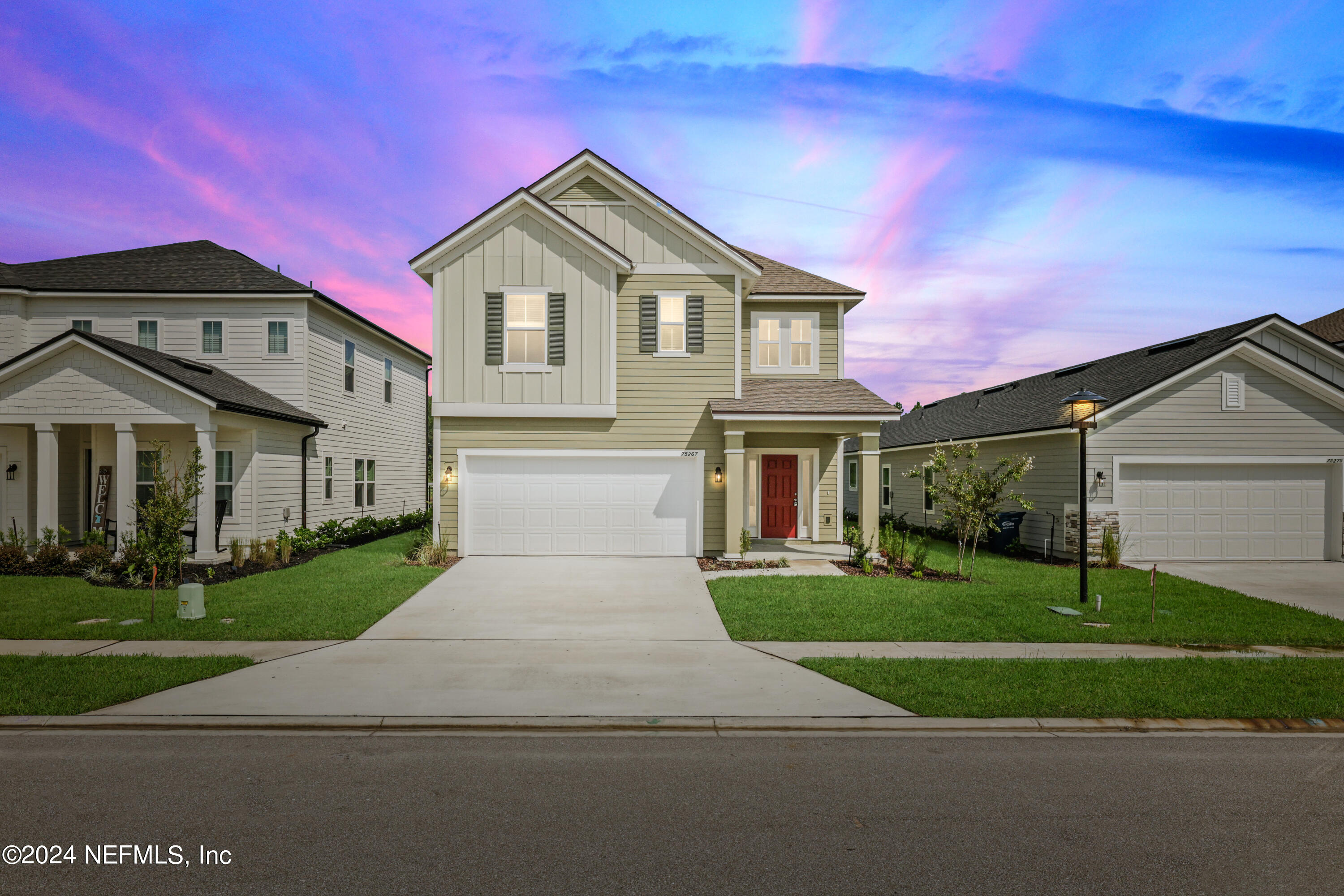 a front view of a house with a yard