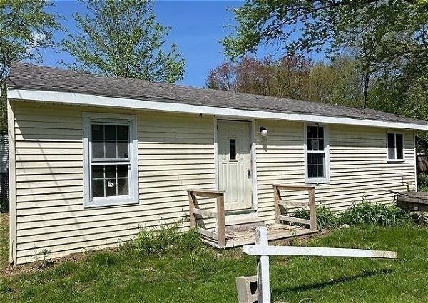 a view of a house and a yard