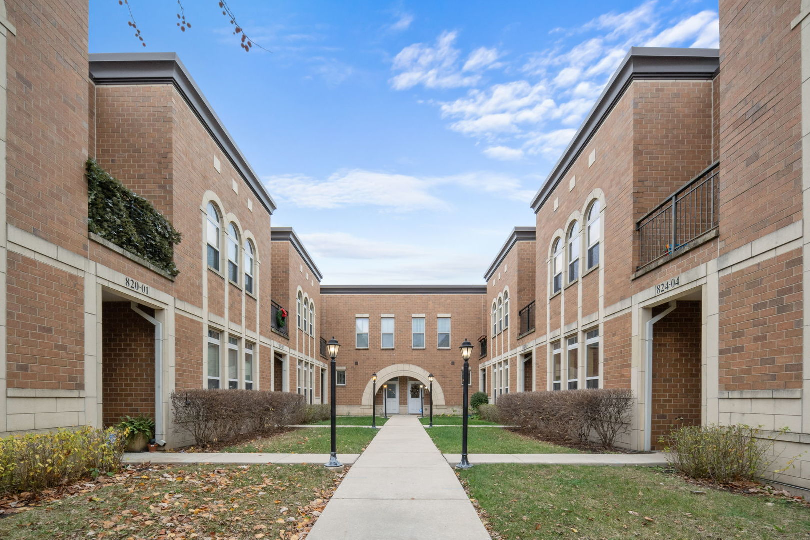 a front view of a building with garden