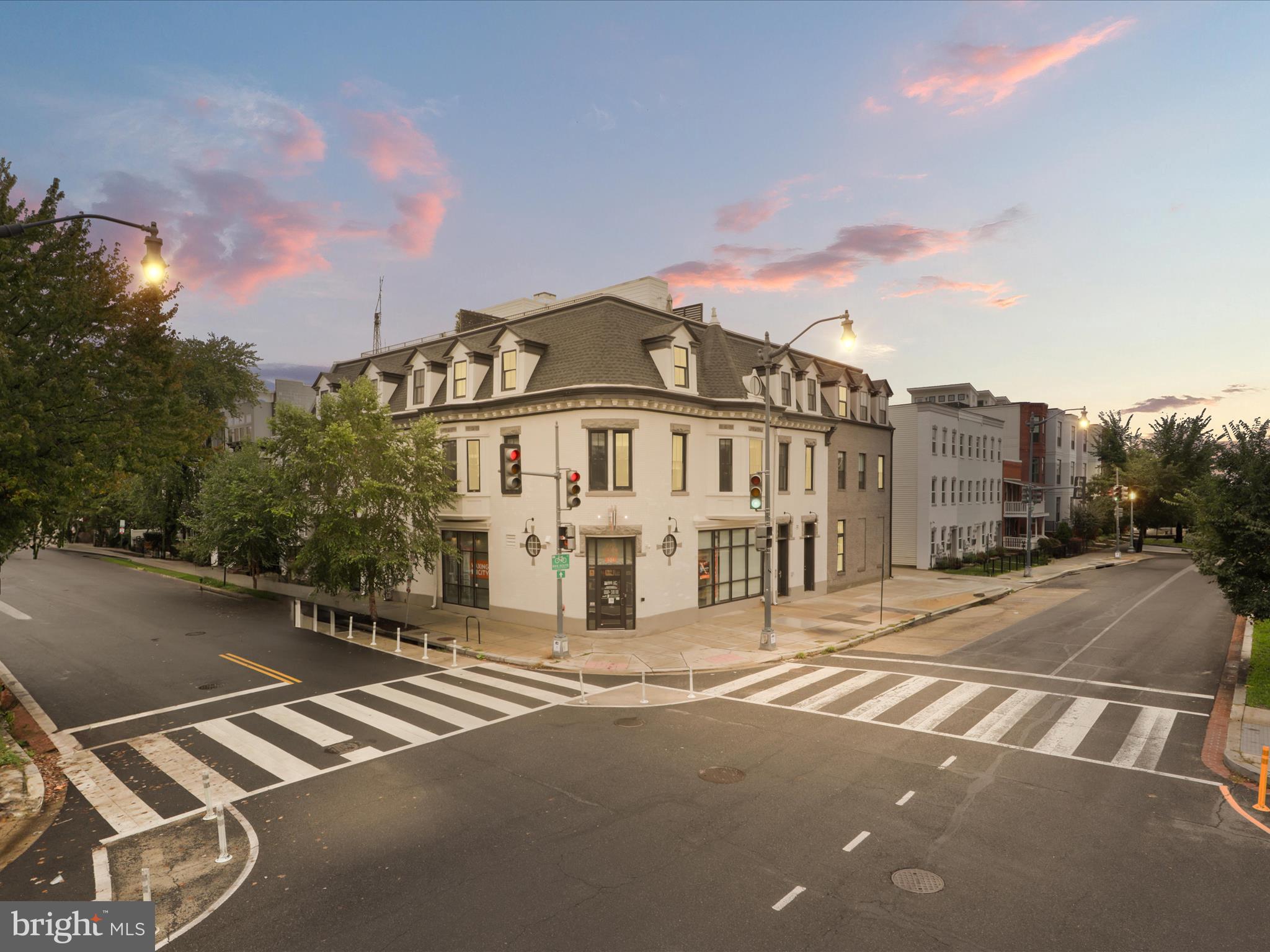 a view of a street with a building in the background