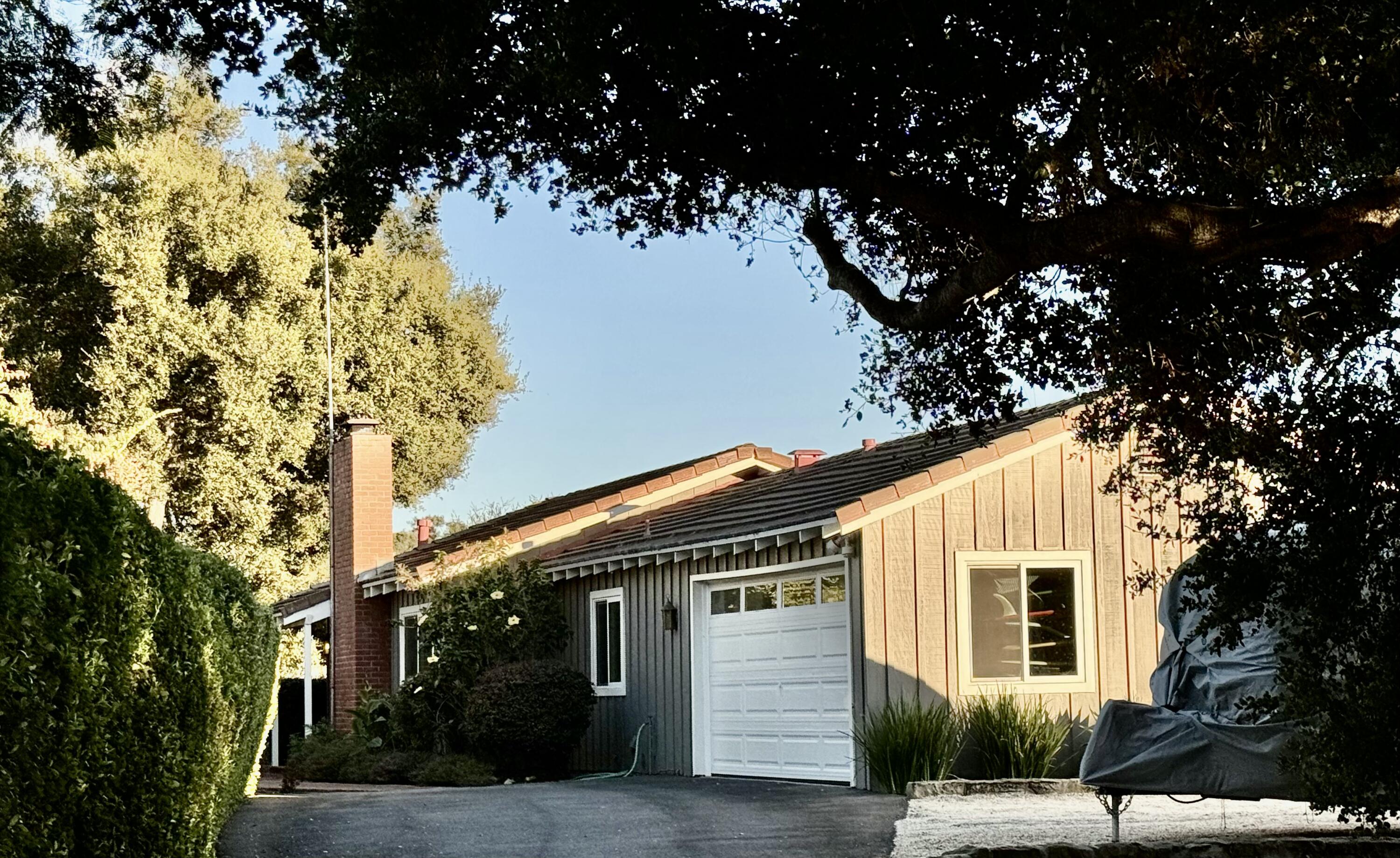 a view of a house with a tree