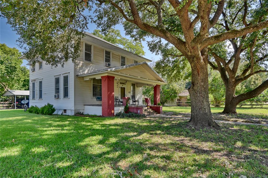 Front side of home with a great view of the large live oak trees.