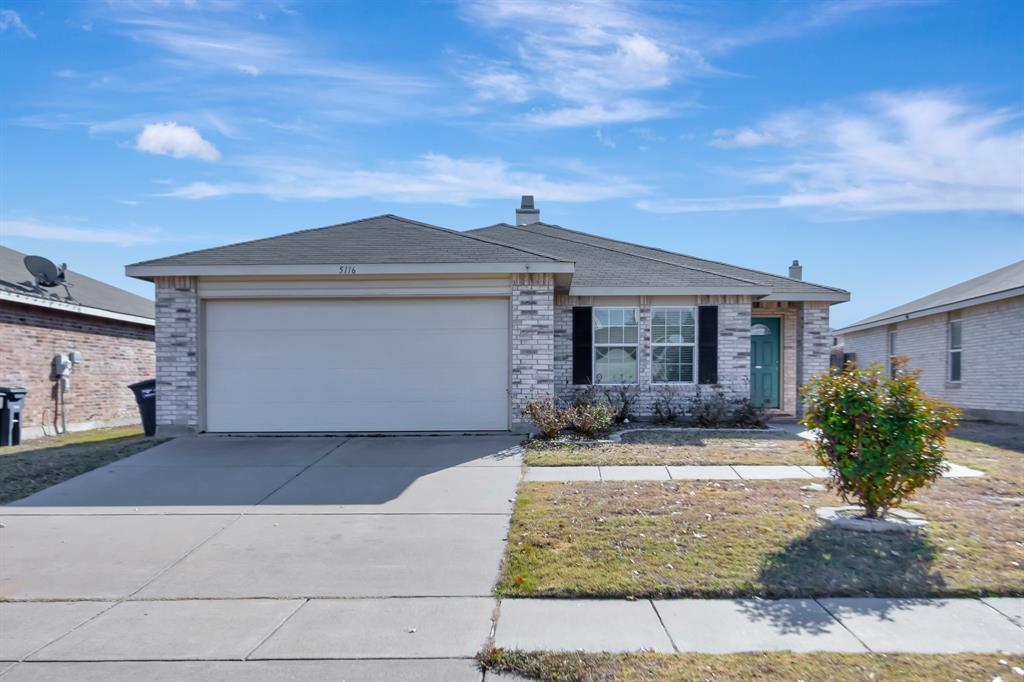 a front view of a house with yard