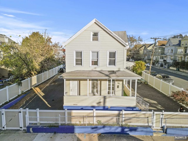 a view of house with swimming pool