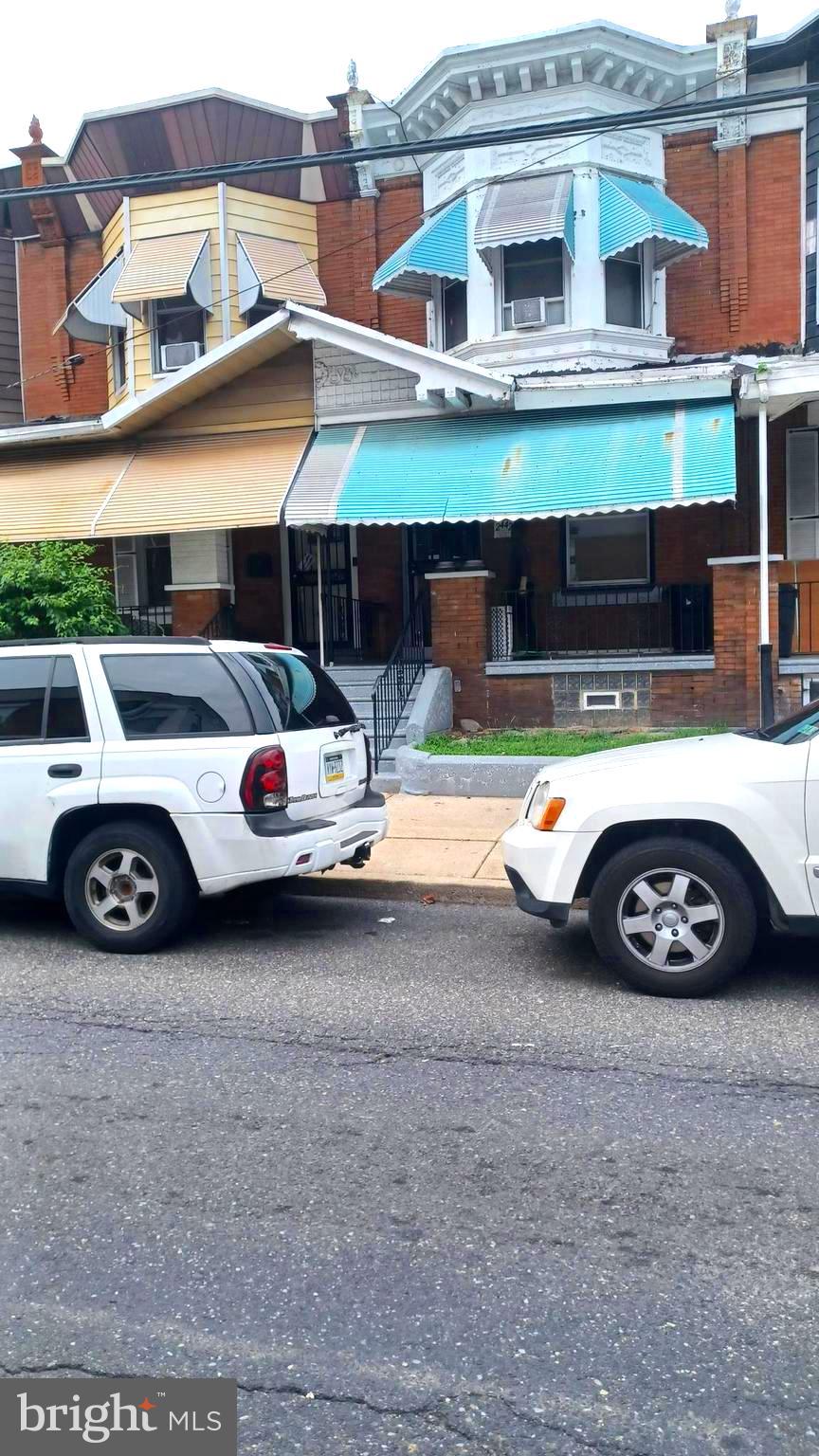 a car parked in front of a house