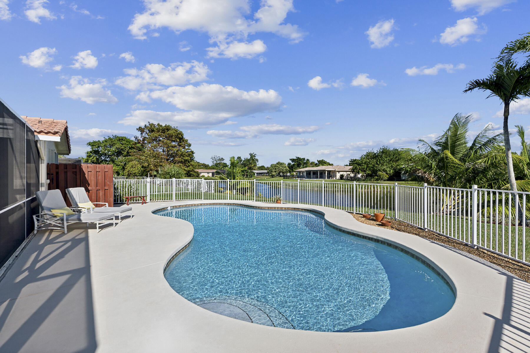 a view of a swimming pool with a lounge chair