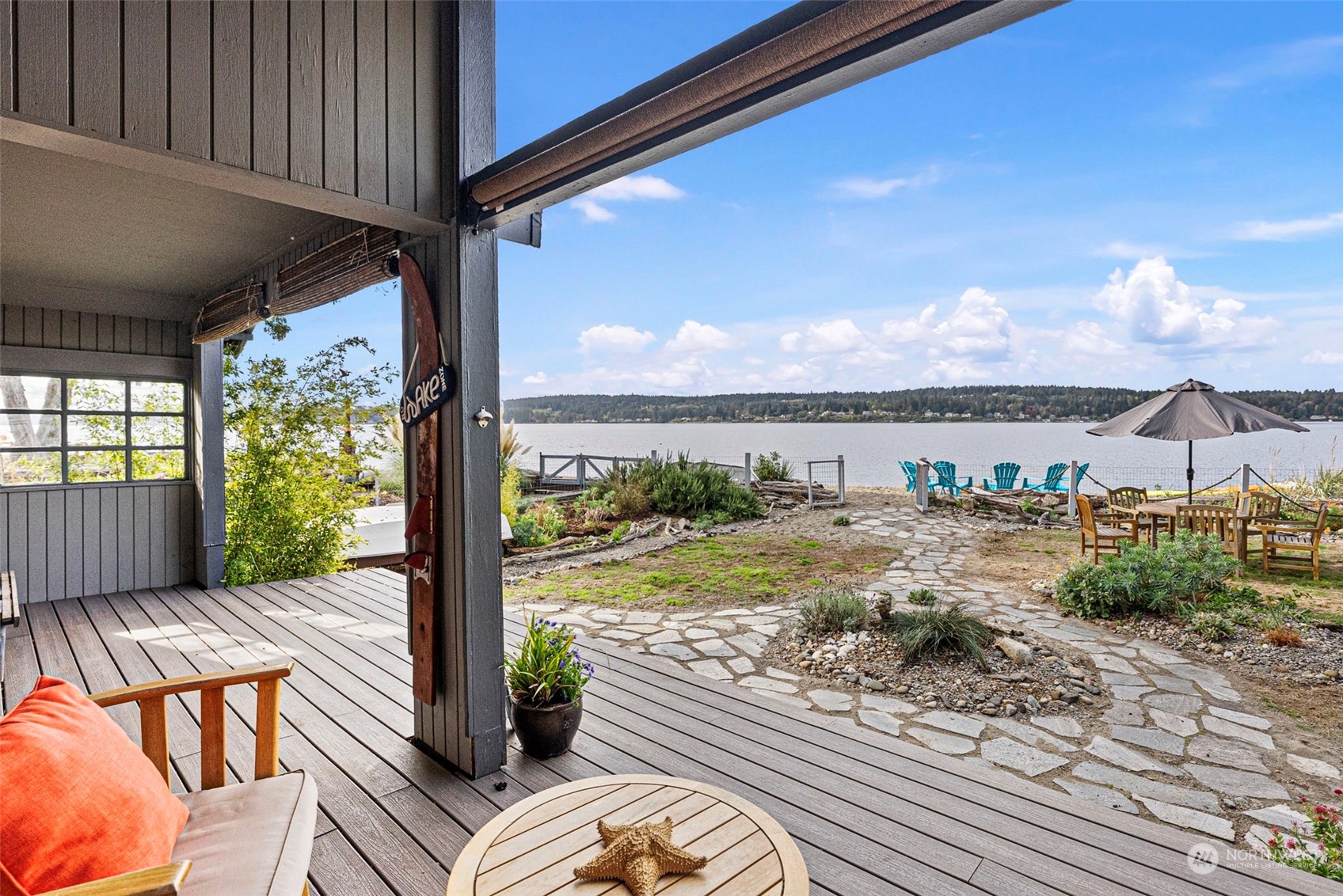 a view of a balcony with lake view and a floor to ceiling window