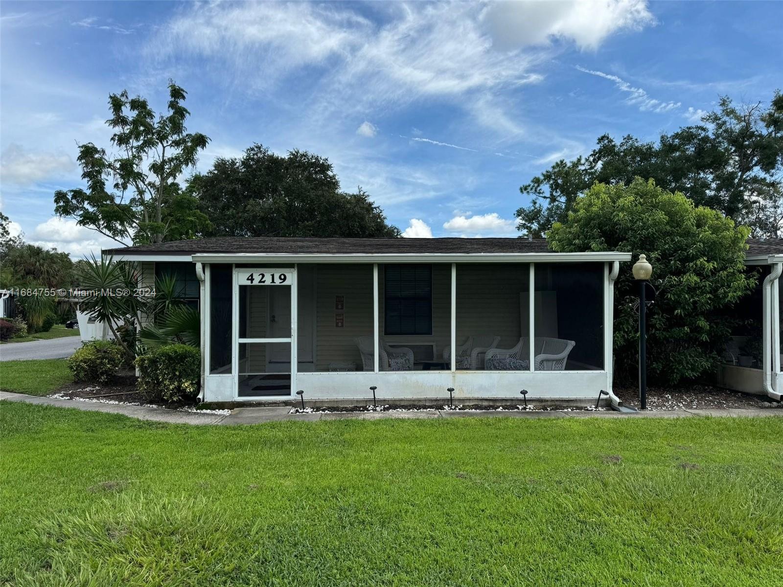 front view of a house with a yard