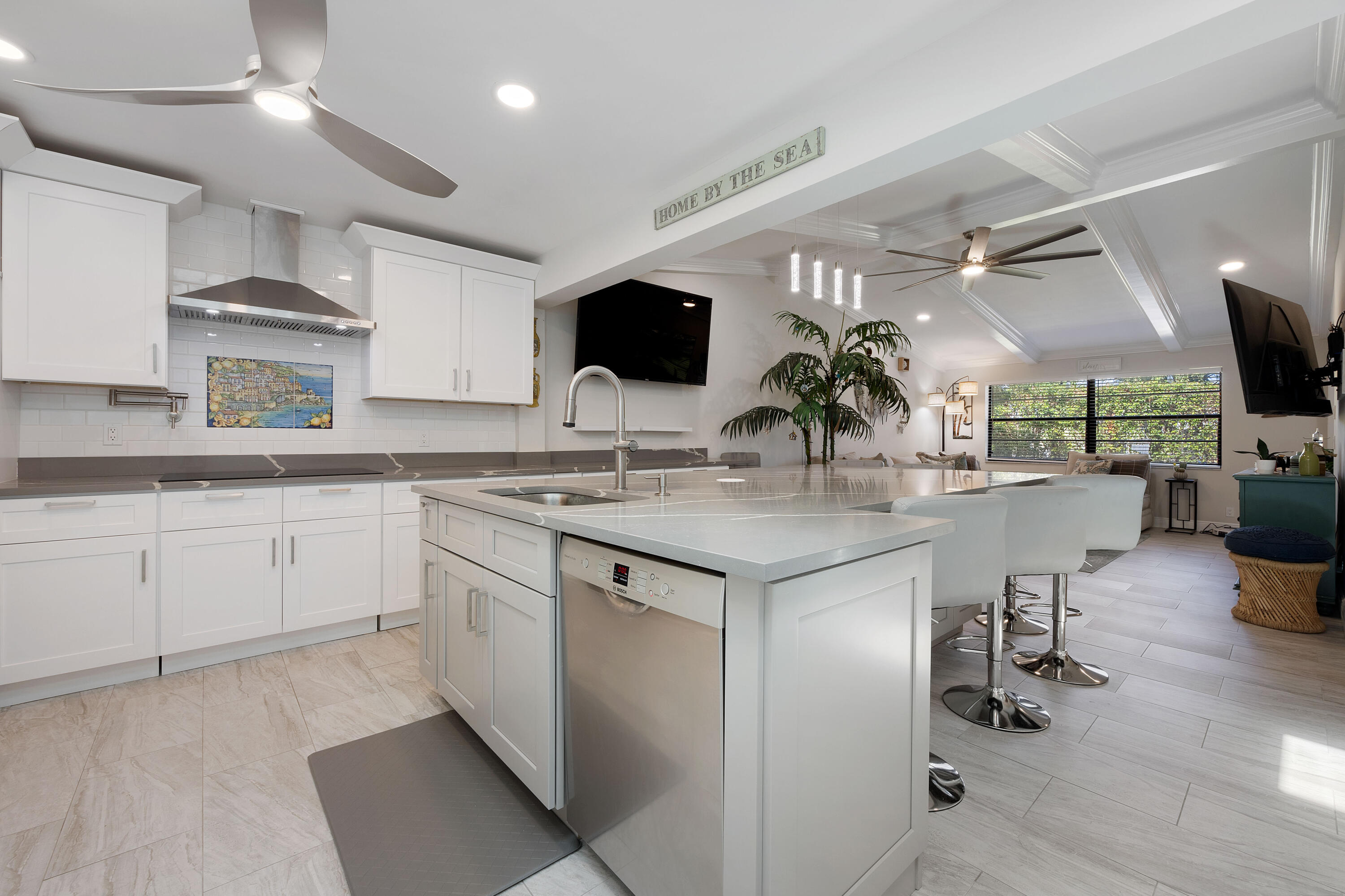 a kitchen with a sink stainless steel appliances and cabinets