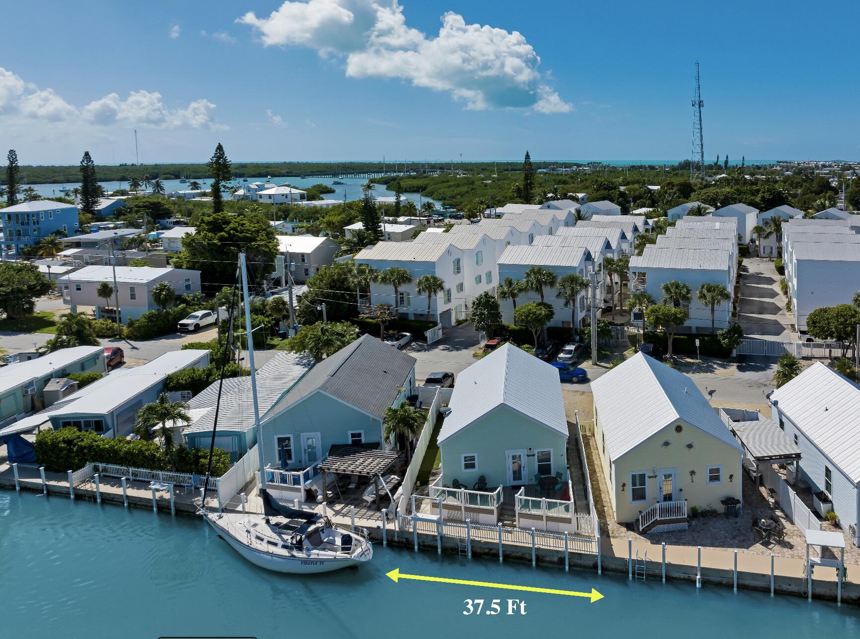 an aerial view of a house with a ocean view