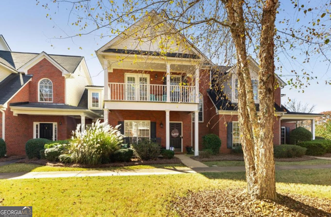 front view of a house with a yard