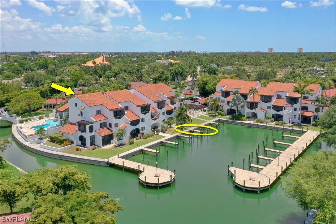 an aerial view of a house with a ocean view