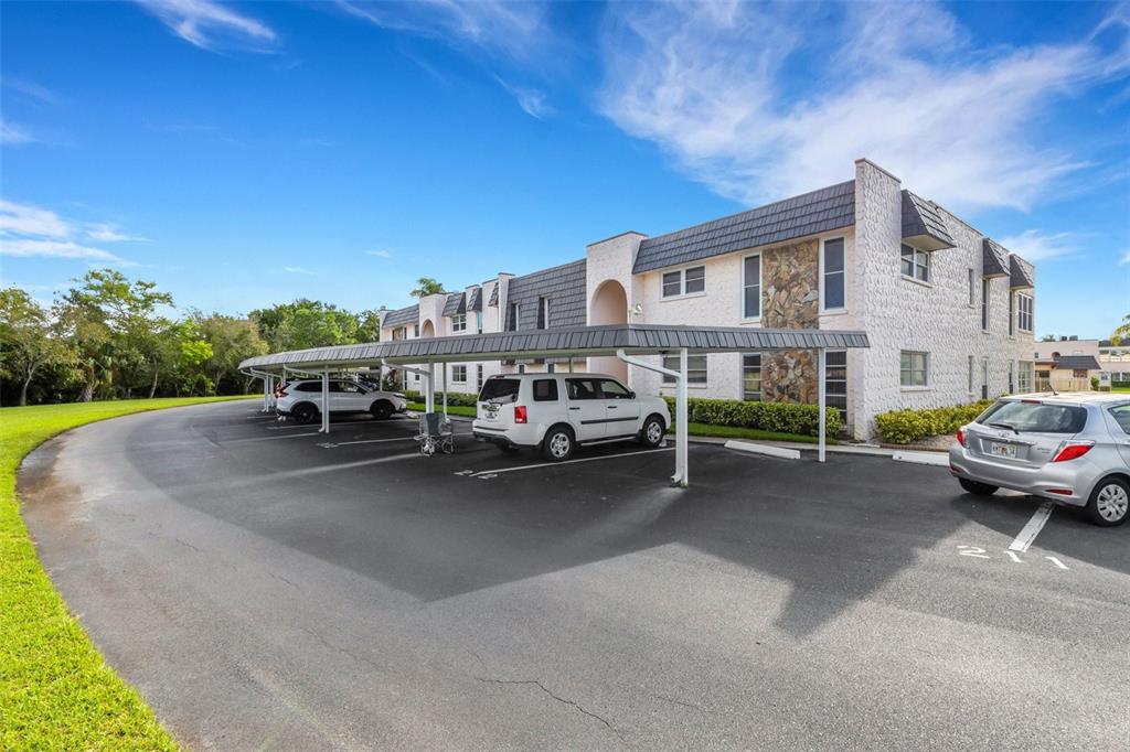 a view of a car park in front of house