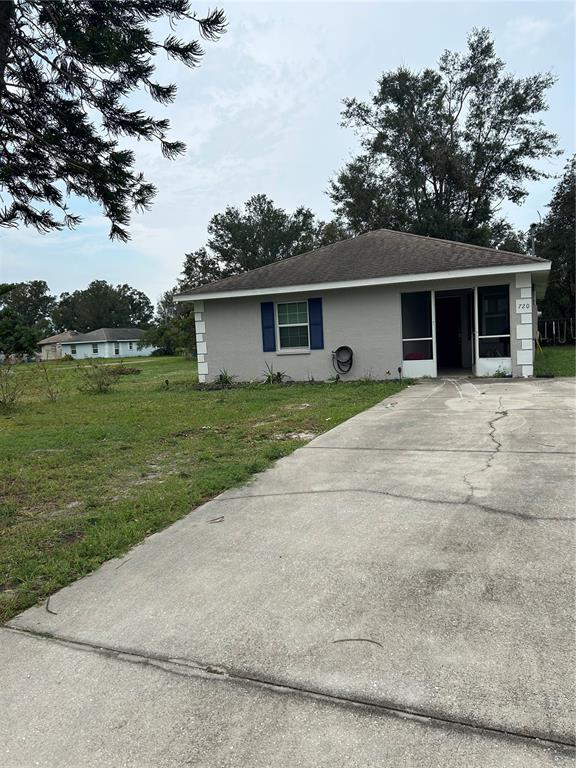 front view of a house with a yard