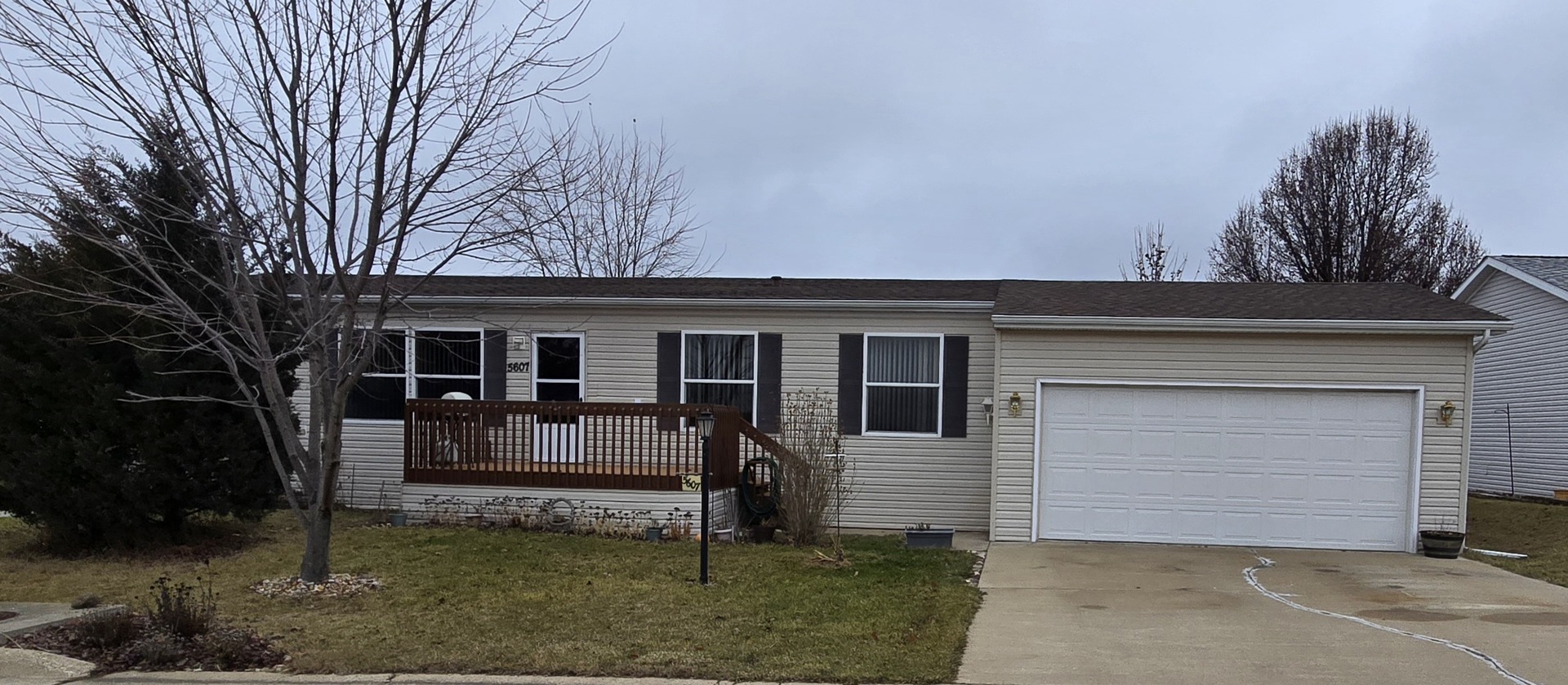 a view of house with backyard and outdoor seating