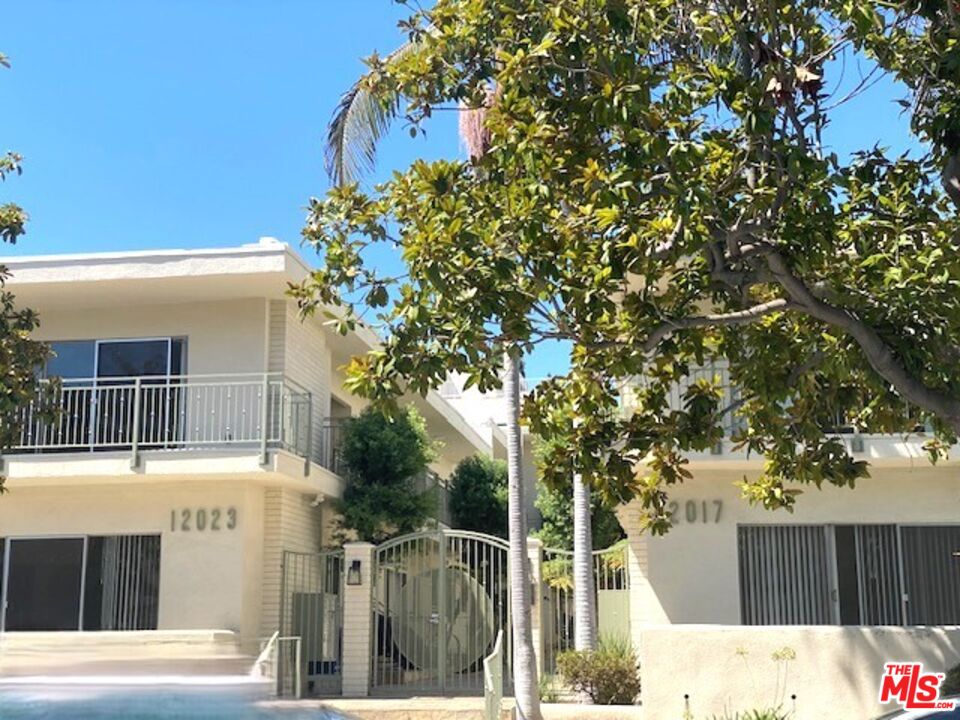 a view of a house with a tree