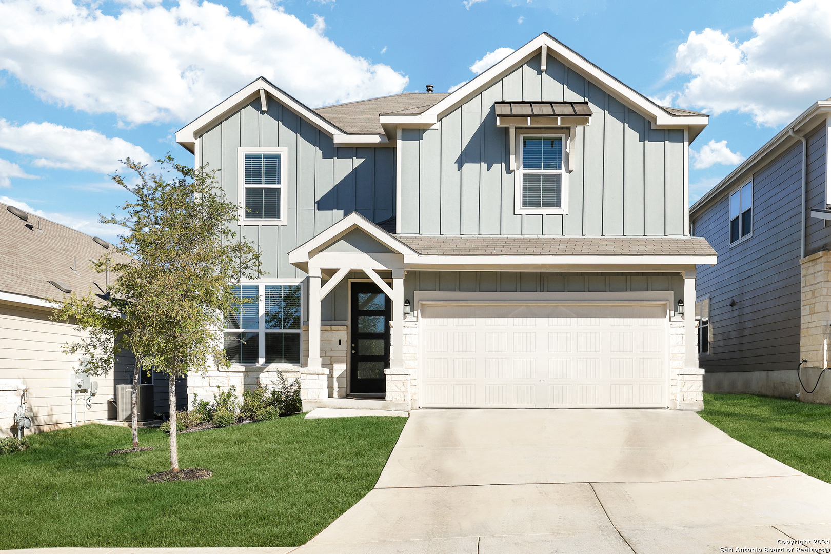 a front view of a house with a yard