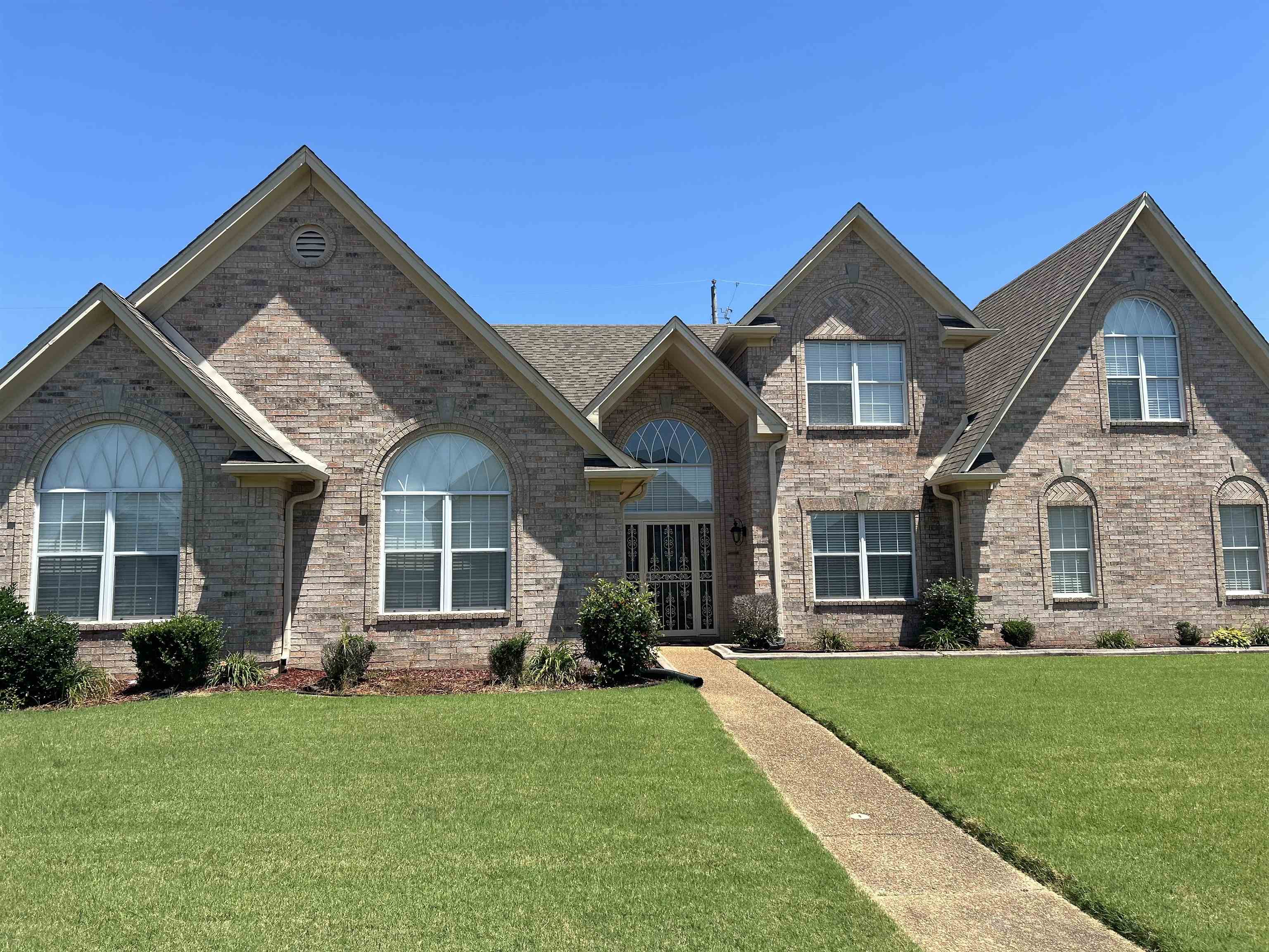 front view of a house with a yard