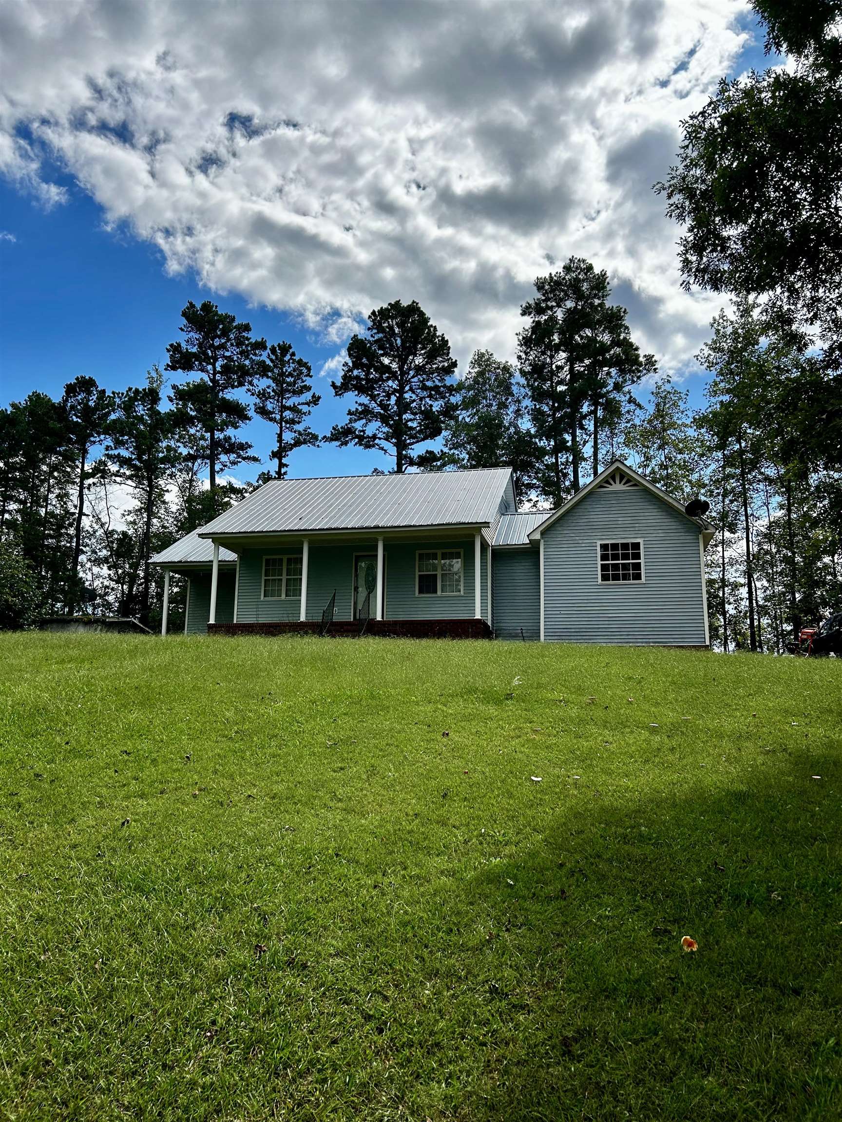 Single story home featuring a front yard