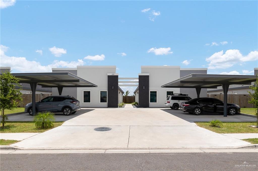 a view of garage with a car parked in it