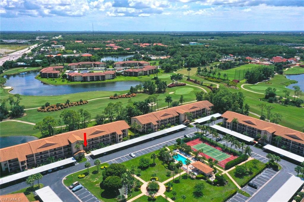 an aerial view of residential houses with outdoor space and street view