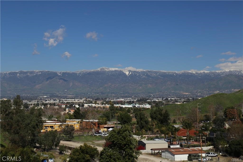 a view of a city with mountains in the background