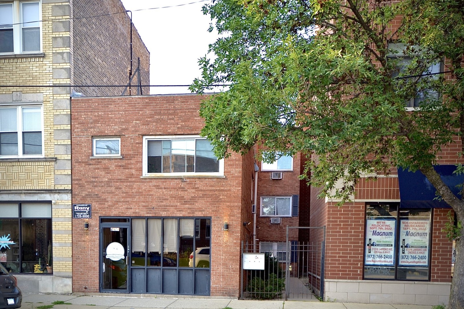 a front view of a building with street view