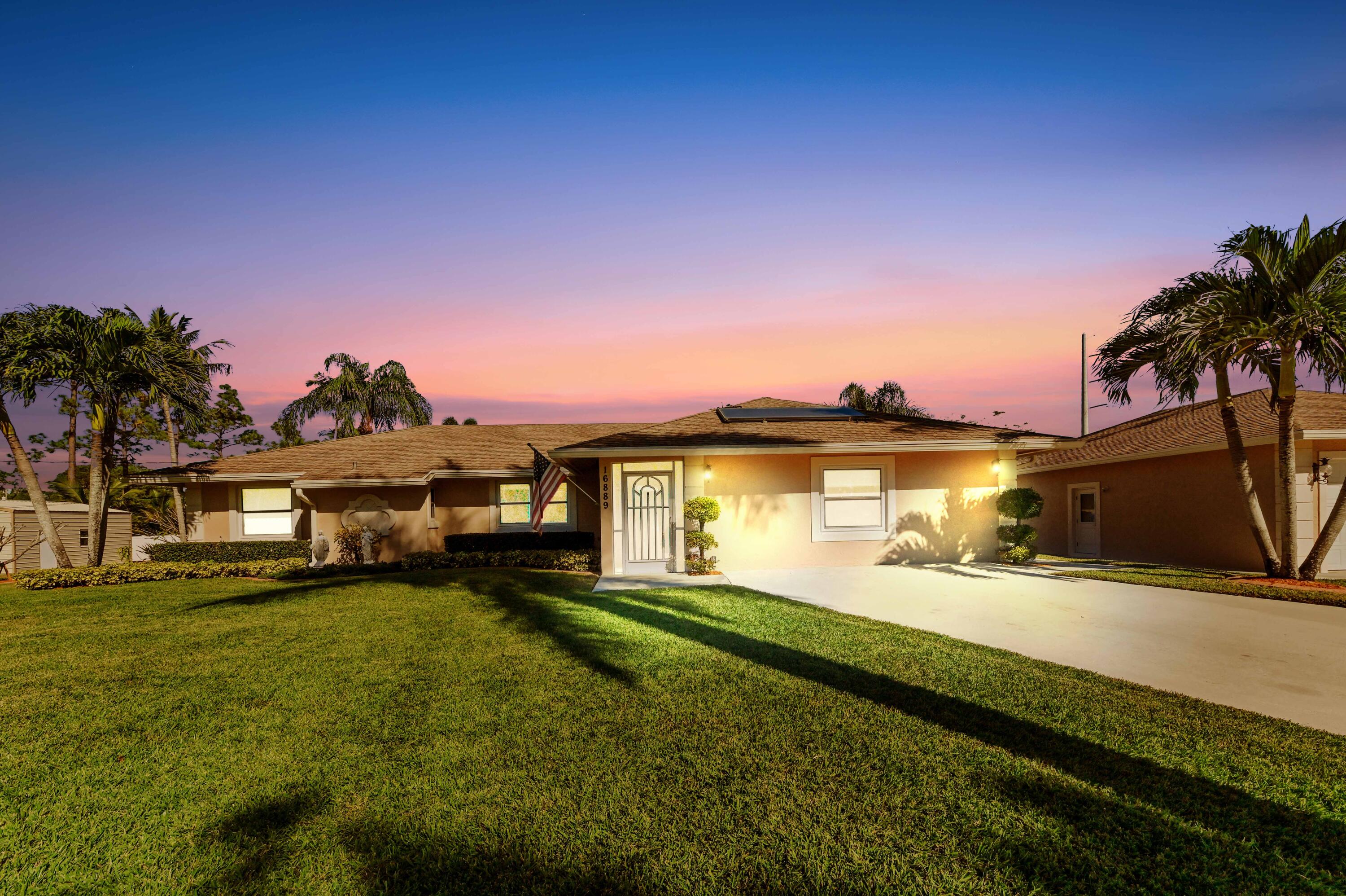 a view of a house with a big yard