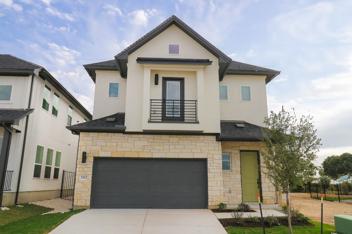 a front view of a house with a garage