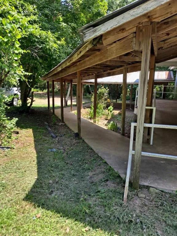 a backyard of a house with table and chairs