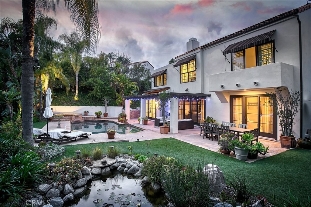 a view of a house with a yard porch and sitting area