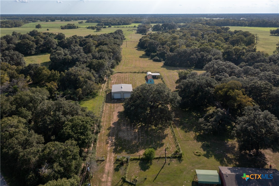 an aerial view of a house with a lake view