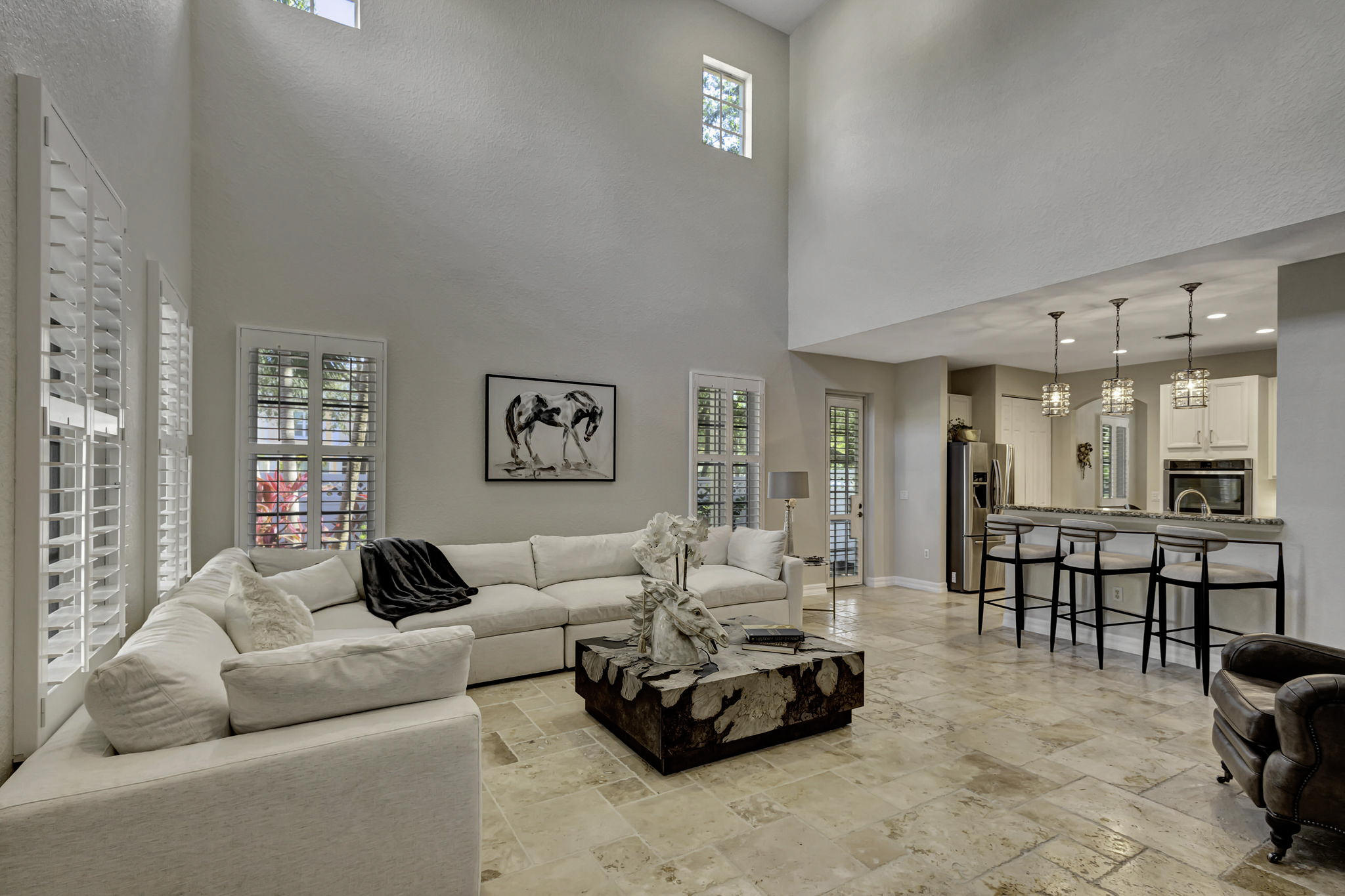 a living room with furniture and a table