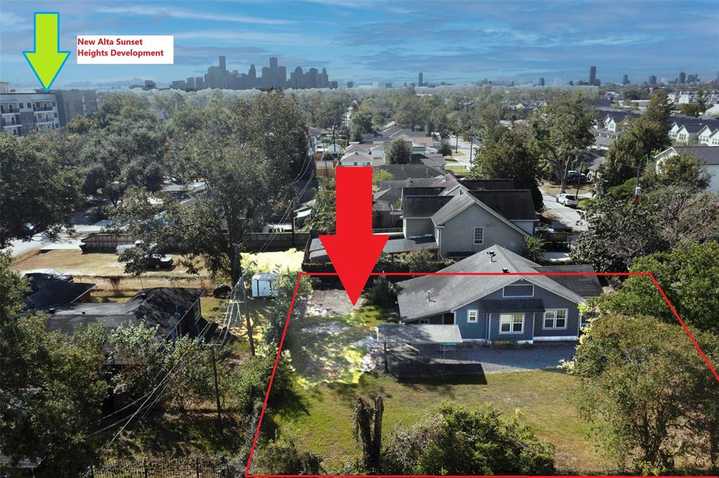 an aerial view of residential house with outdoor space and swimming pool