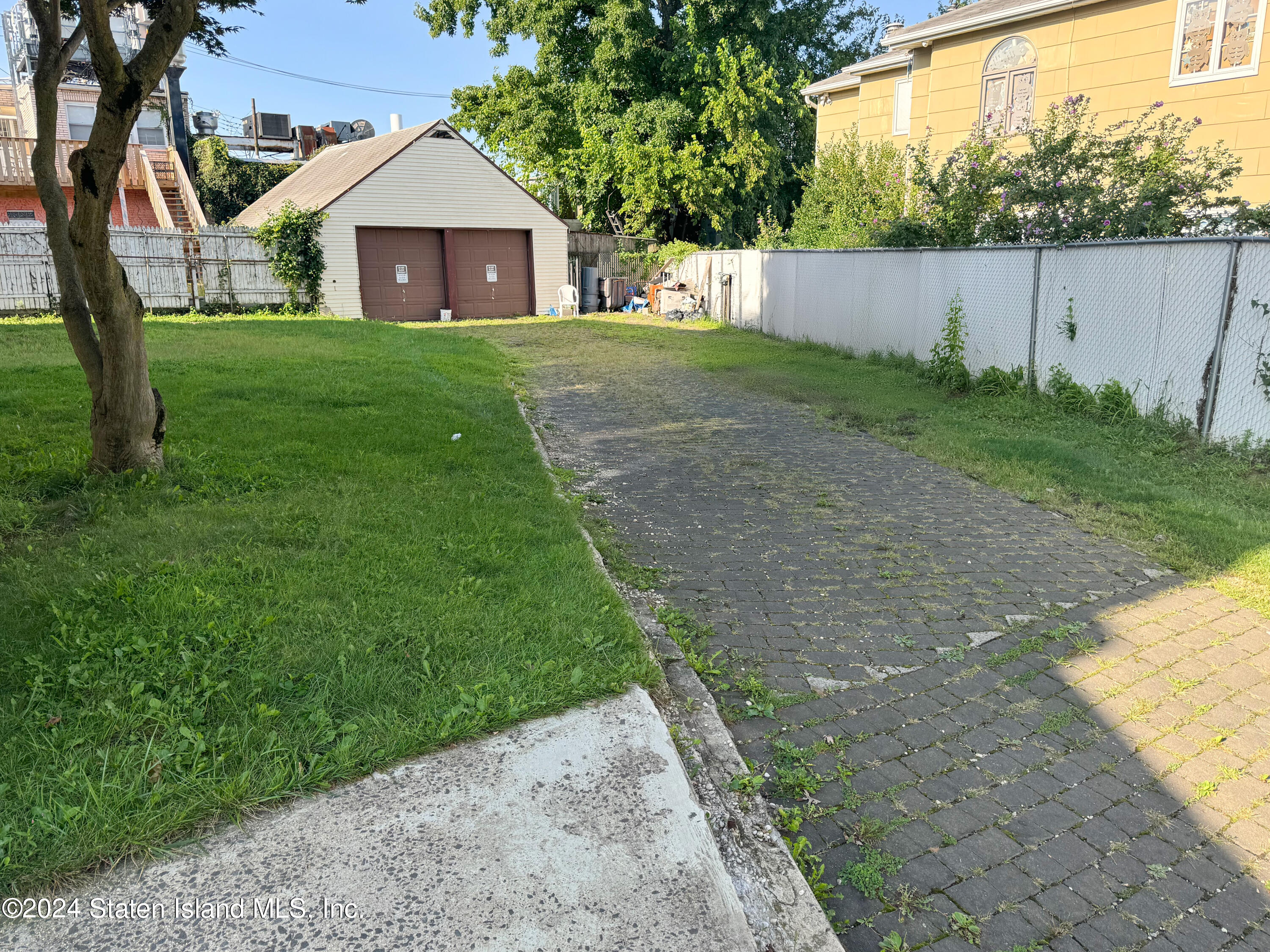 a view of a back yard of the house