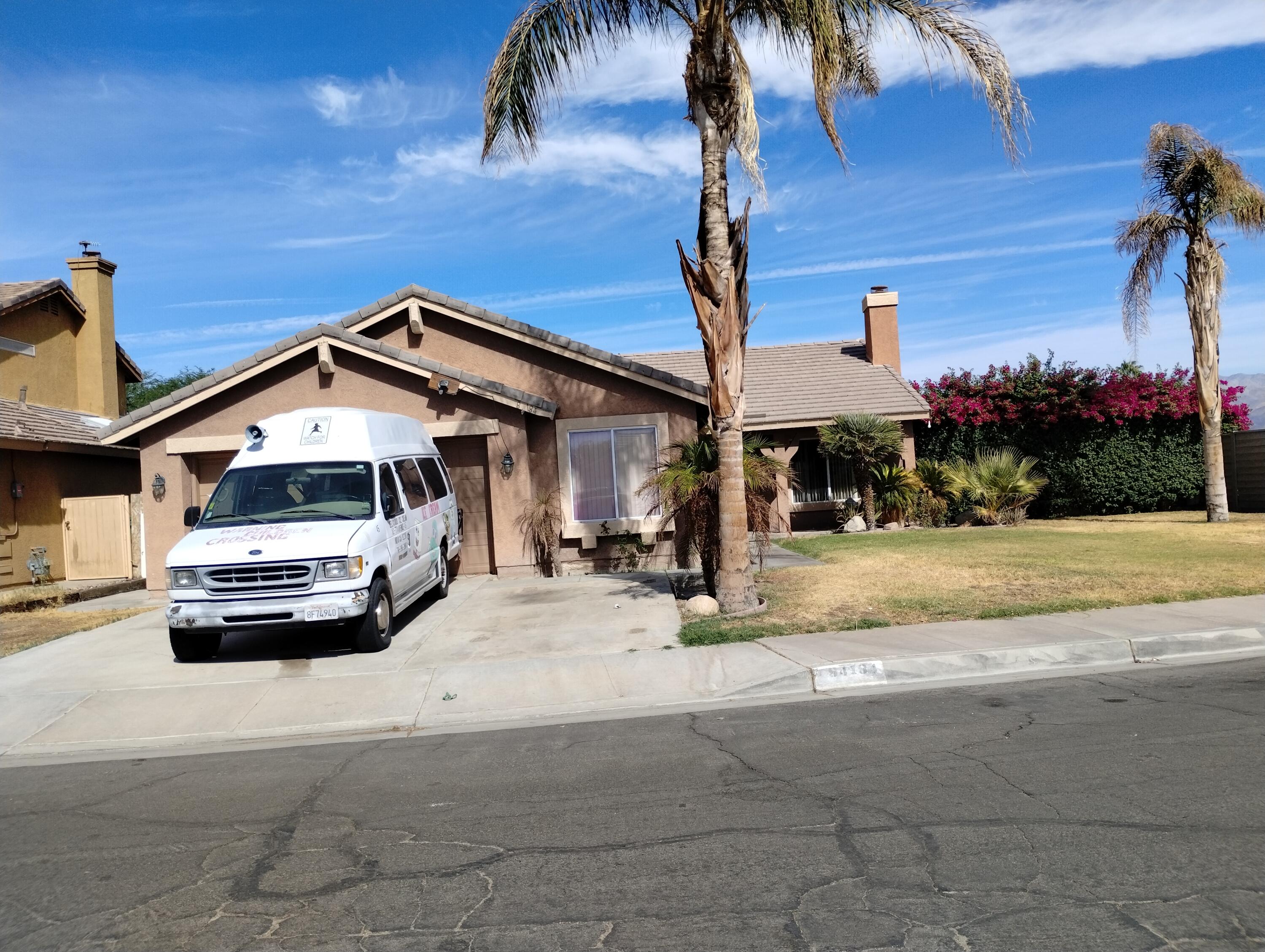 a car parked in front of a house