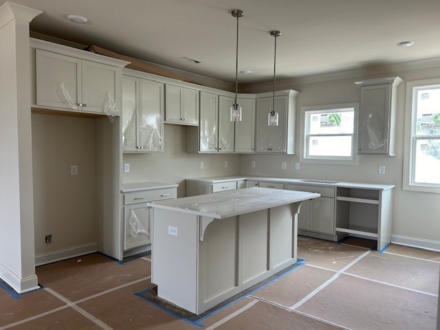 a kitchen with a sink stainless steel appliances and cabinets