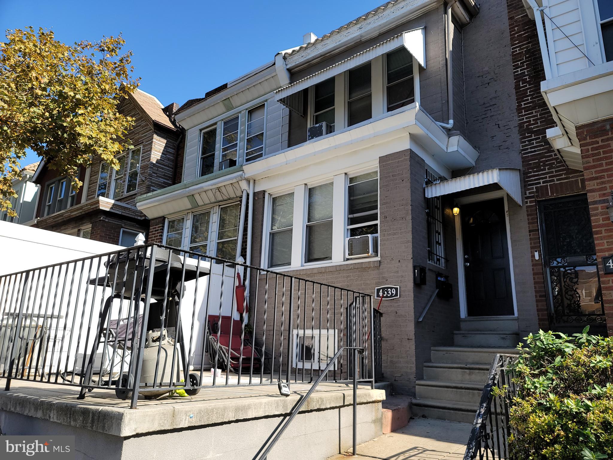 a view of a house with a iron gate