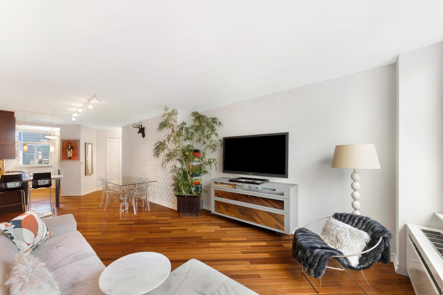 a living room with furniture and a flat screen tv