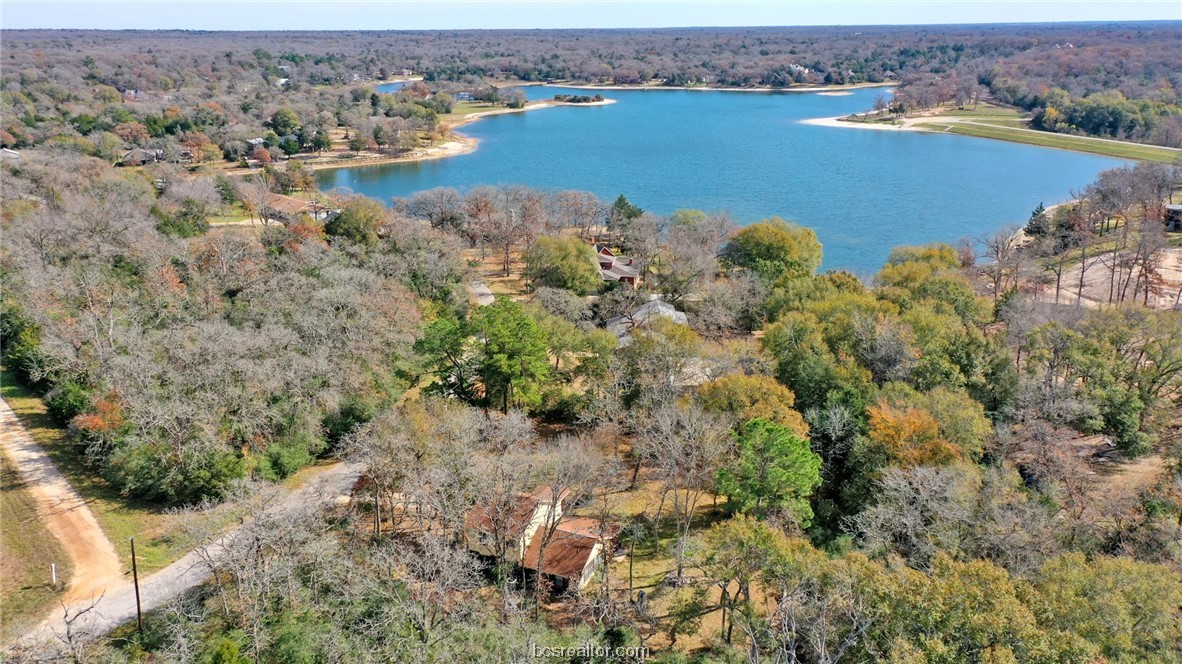 an aerial view of ocean with residential house with outdoor space