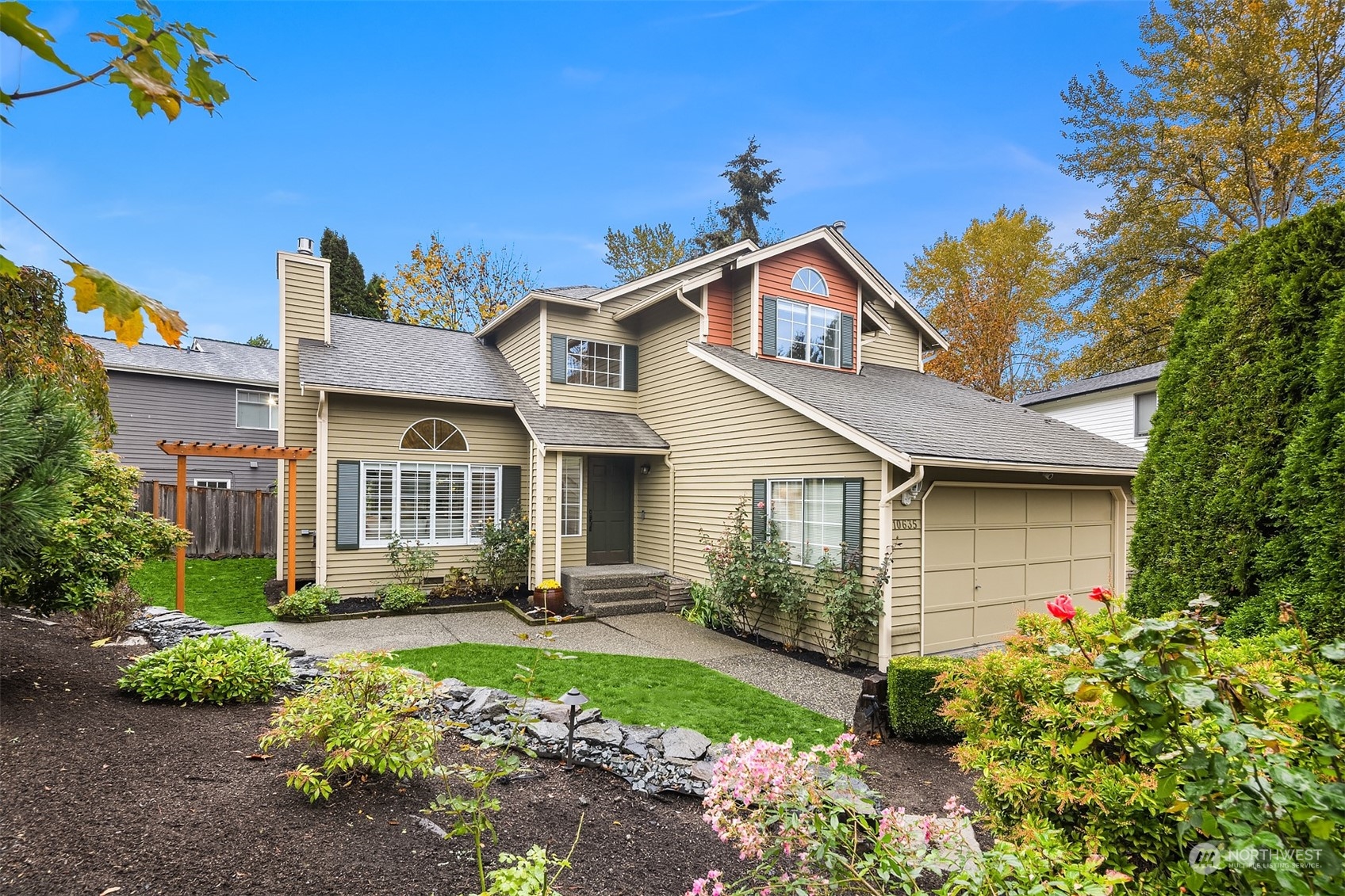 a front view of a house with garden