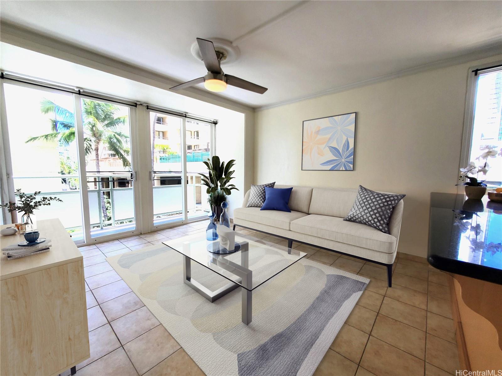 a living room with furniture and floor to ceiling windows