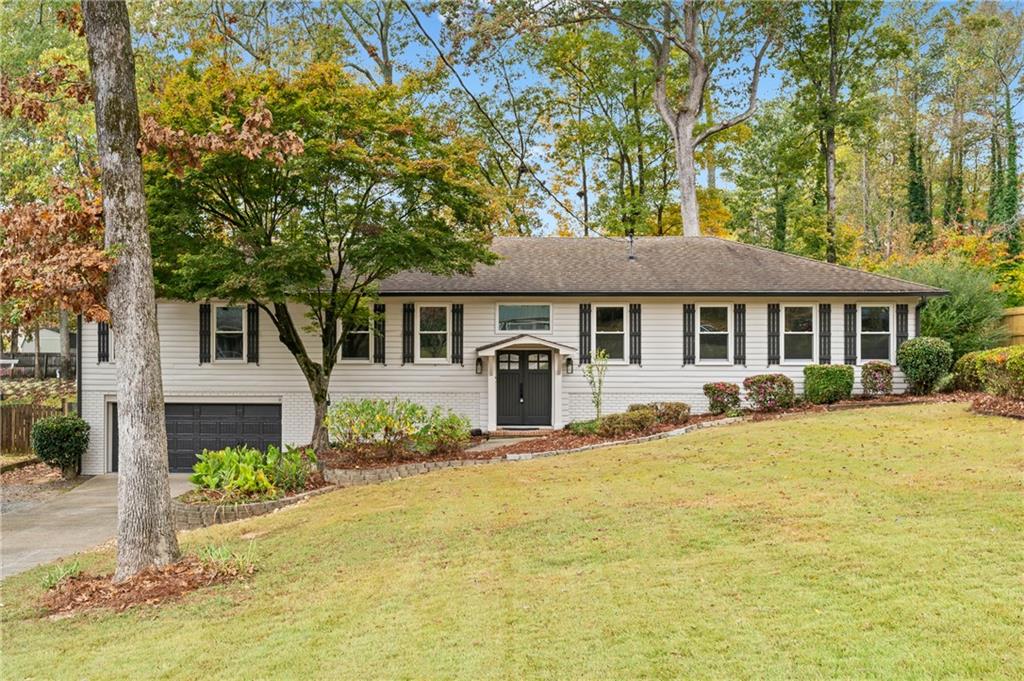 a front view of a house with a yard