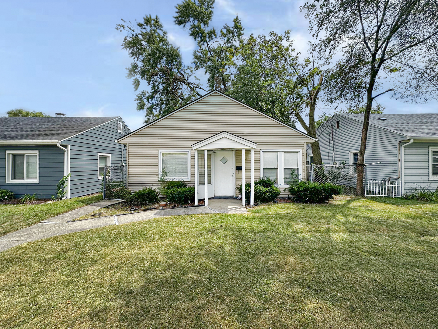 a front view of a house with a yard and porch