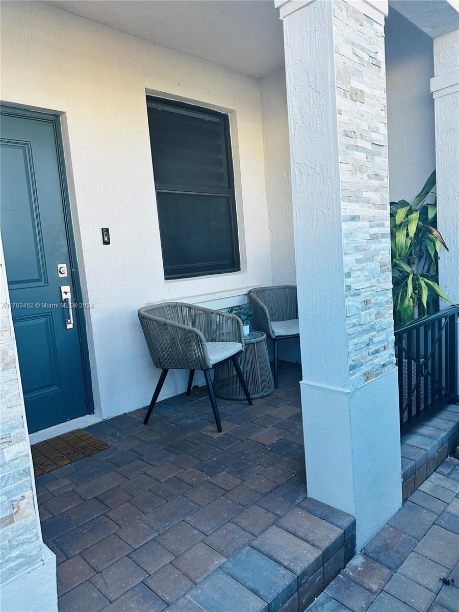 a view of a hallway with entryway door