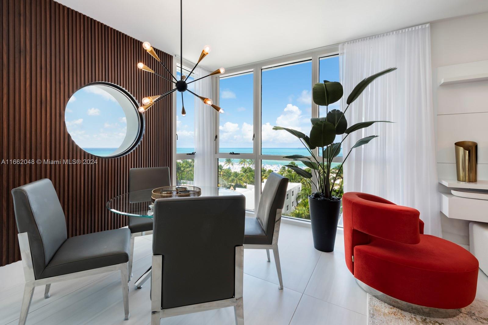 a view of a livingroom with furniture and a potted plant