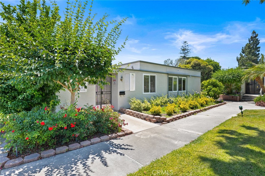 a front view of a house with garden